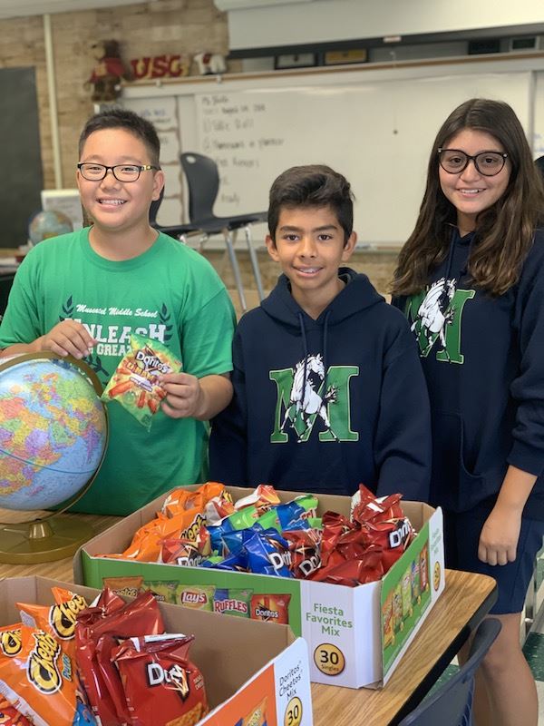 ASB students passing out prizes for Spirit Day